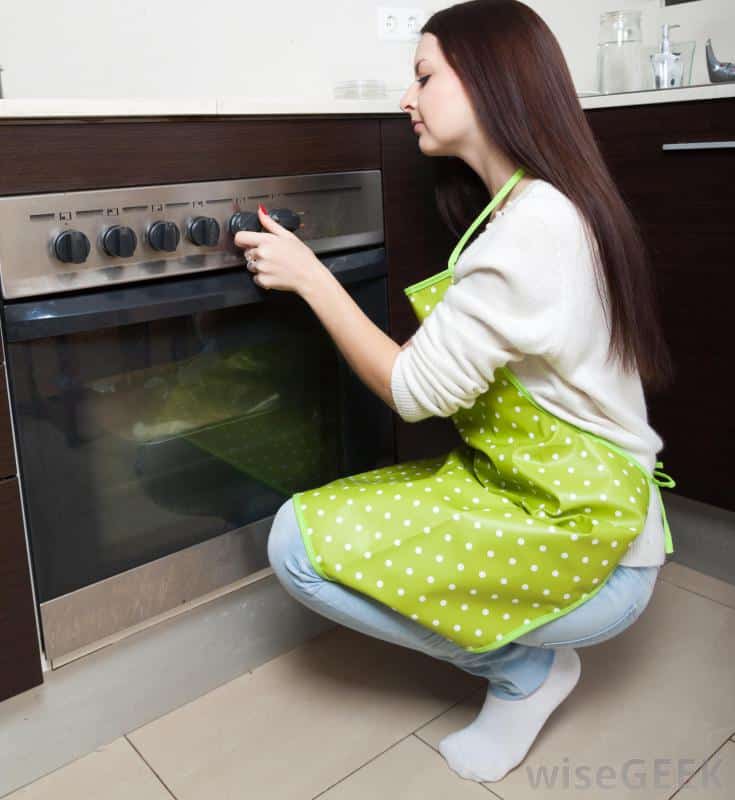 How To Clean Stoneware Tips For Care And Love Stoneware   Woman Knelt Down By Oven 